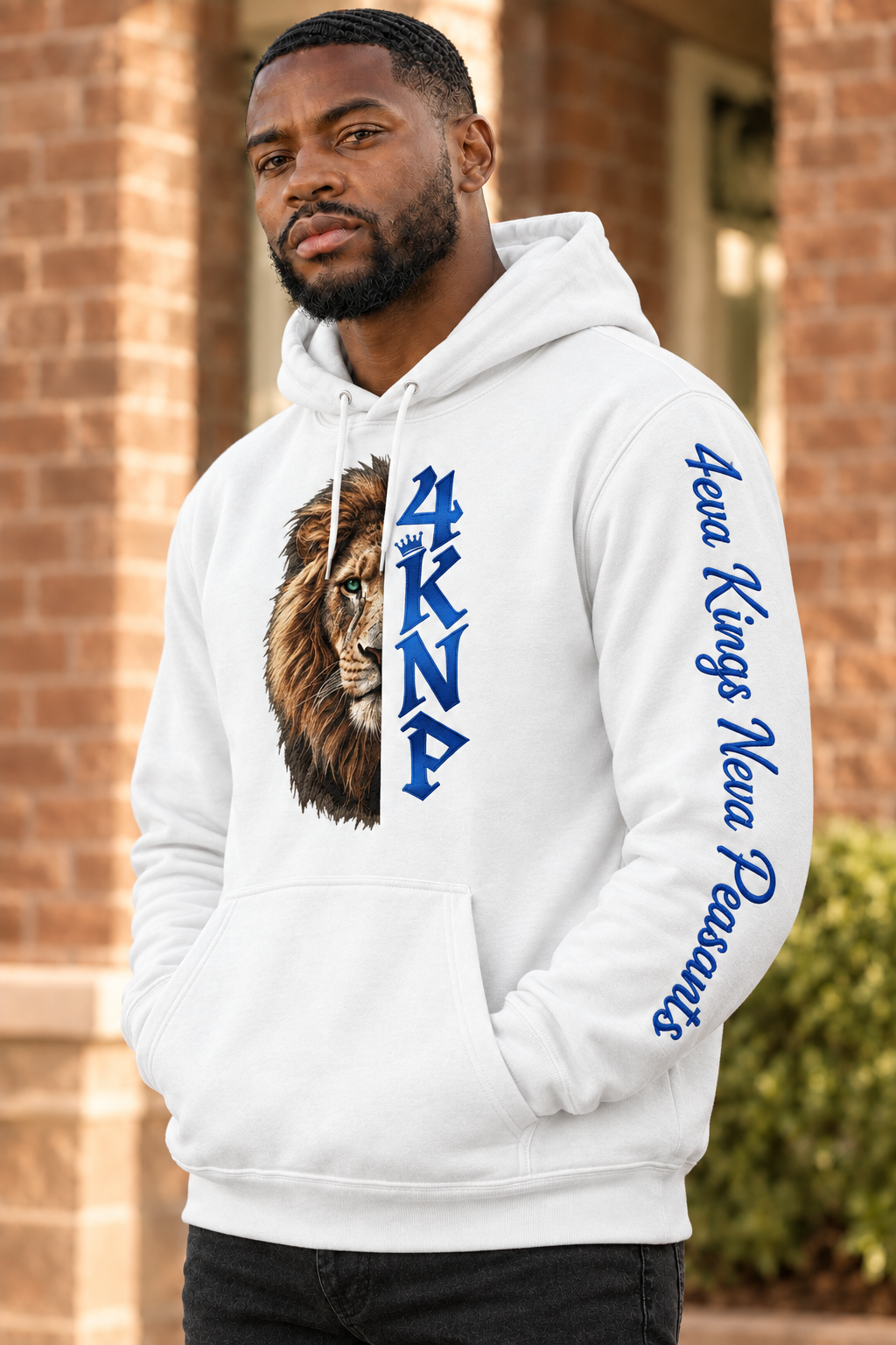 Man wearing white 4KNP Half-Lion hoodie with blue lettering and sleeve embroidery